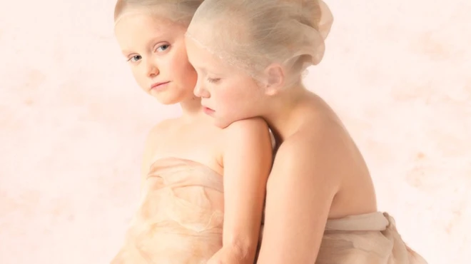 Two young girls posing for photoshoot