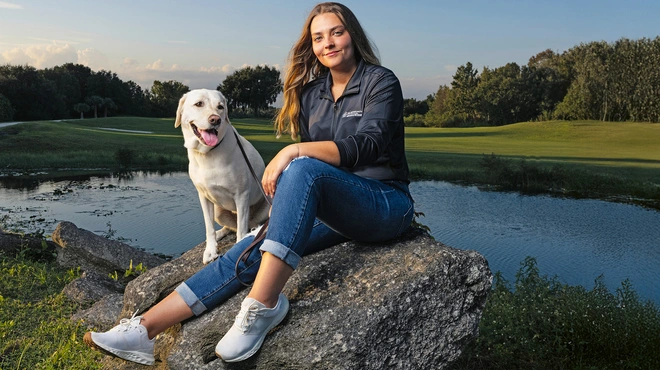 Kate Kostelyk, IgA nephropathy (IgAN) patient, and her labrador Dakoda in Mims, Florida